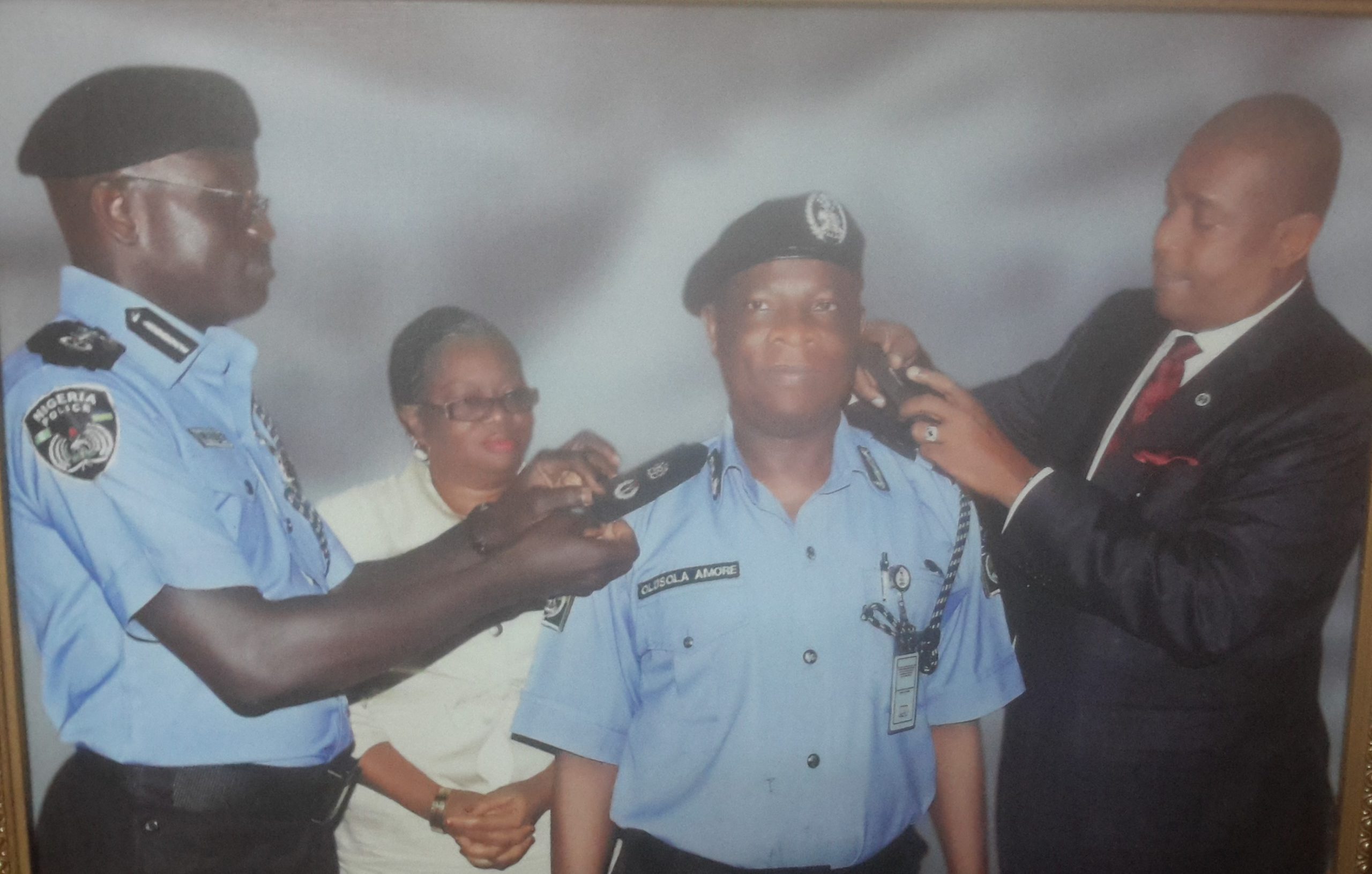 CP OLUSOLA AMORE BEING DECORATED BY IGP ABBA AND IGP ARASE AS CP.