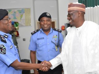 CP AMORE WITH HIS RELIEVER BEFORE GOVERNOR AHMED FATAI OF KWARA.